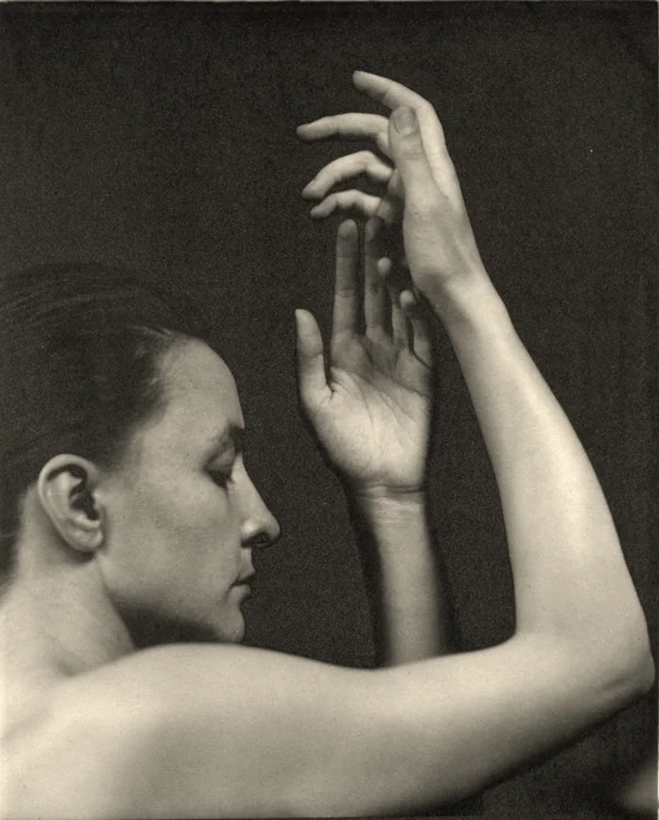 georgia-o-keeffe-in-a-side-portrait-with-nude-arms-and-shoulders female