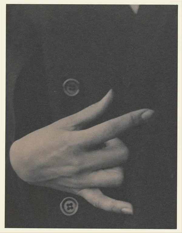 georgia-o-keeffe hand-on-coat-with-buttons female