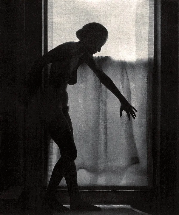 unknown-shadow-in-front-of-window-sillouette-naked female