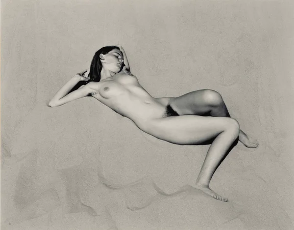 nude-charis-wilson-laying-on-the-beach-naked-full-body female
