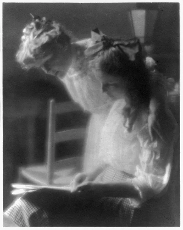 agnes-lee-with-older-daughter-reading-newspaper female