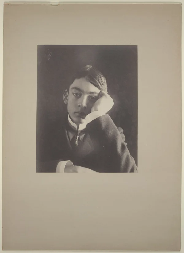 boy-suit-hand-against-face male