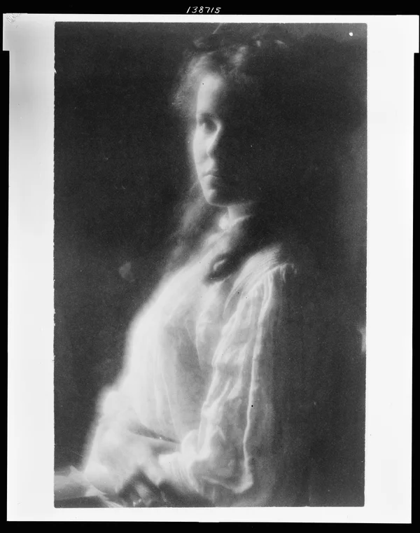 lee-white-dress-folded-arms female