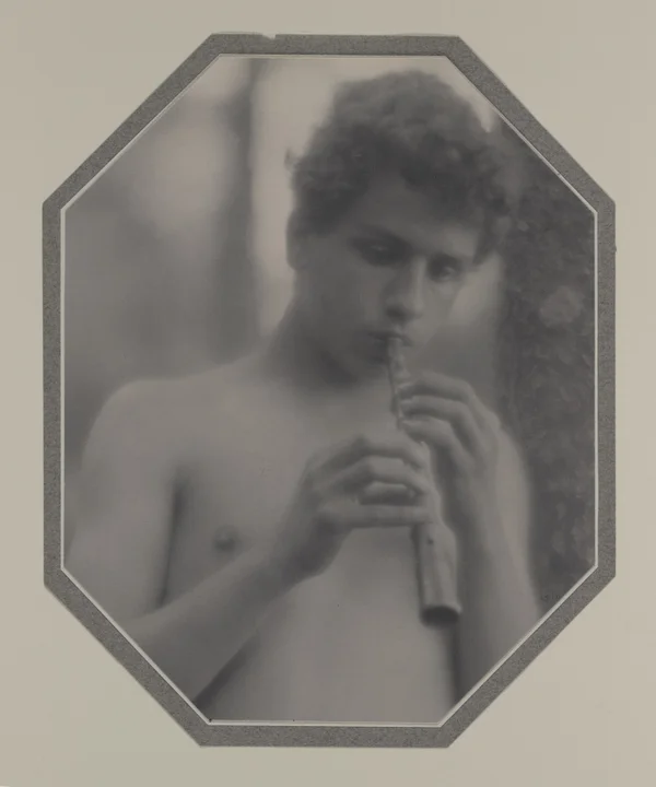 nude-youth-playing-pipe male