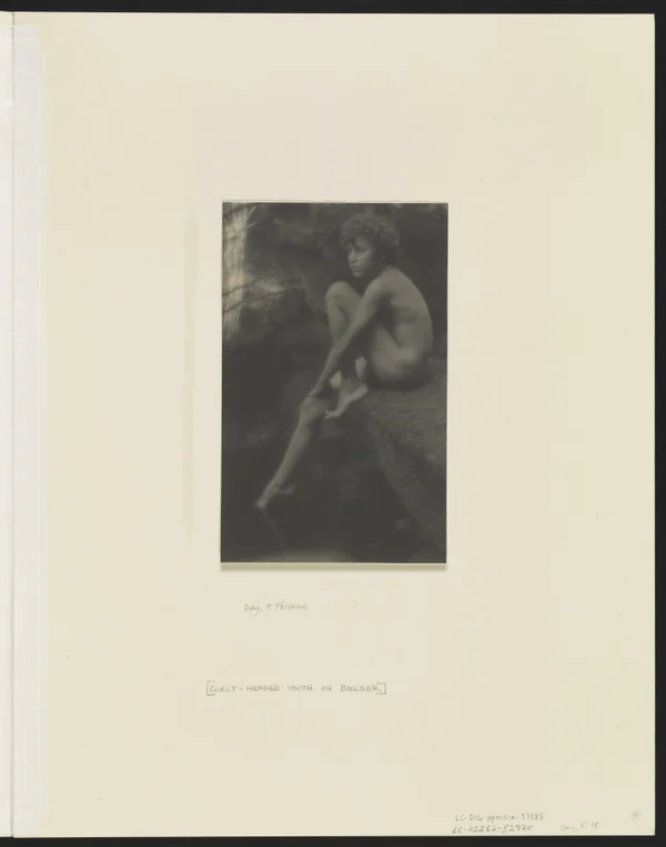 nude-youth-seated-rock male