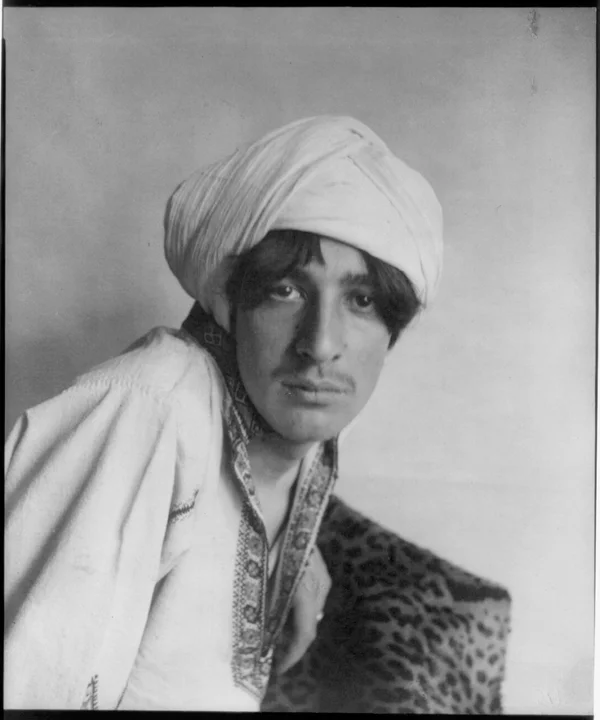 young-man-middle-eastern-costume-turban-leopard-skin-studio male