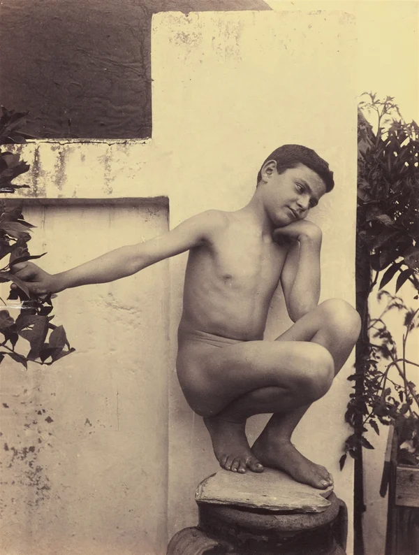boy-on-a-giara-over-wall-with-plants-naked-neapolitan-boy-sitting male