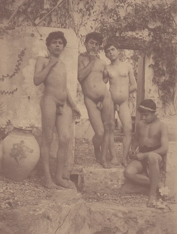 four-youths-standing-in-front-of-garden-entrance male