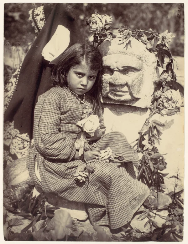 girl-sitting-by-mascaron female