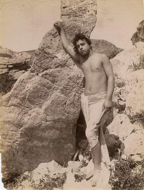 pasquale-barechested-leaning-on-vertical-rock stamped-dated-1-dez-1902 male