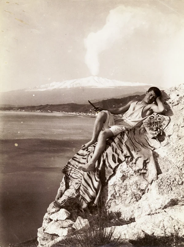 young-male young-male-posed-on-cliff-with-etna-vulcano-smoking-in-the-background male