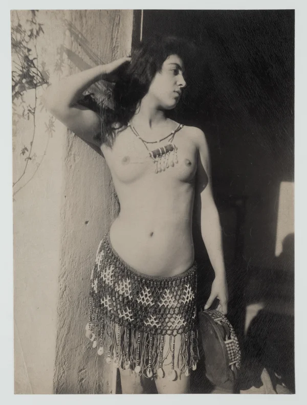 barebreasted-woman-in-beaded-skirt female