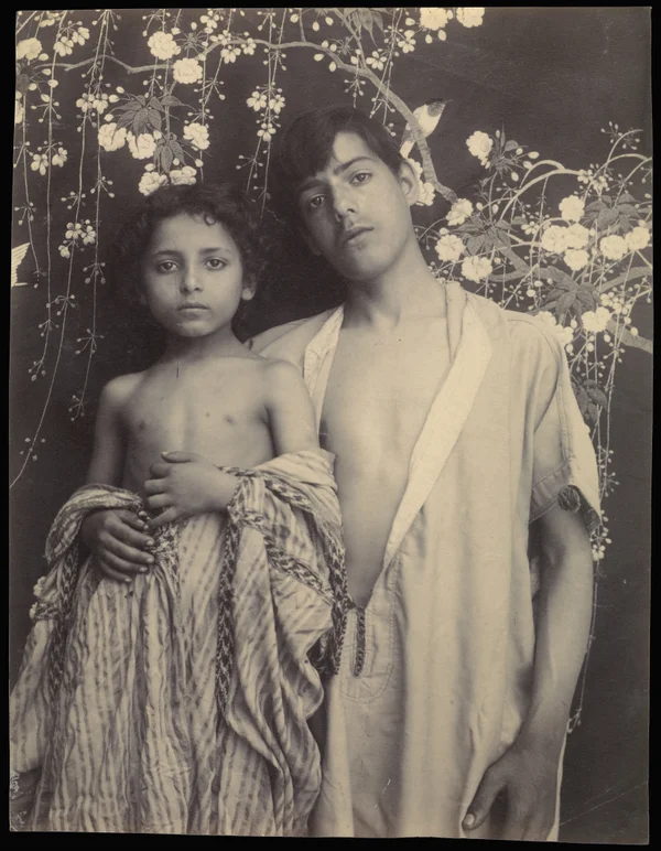 boy-and-girl-before-floral-textile mixed-genders
