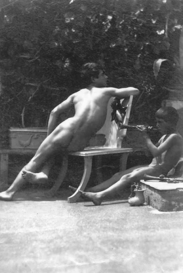 boy-sitting-from-behind-and-child-playing-fife male