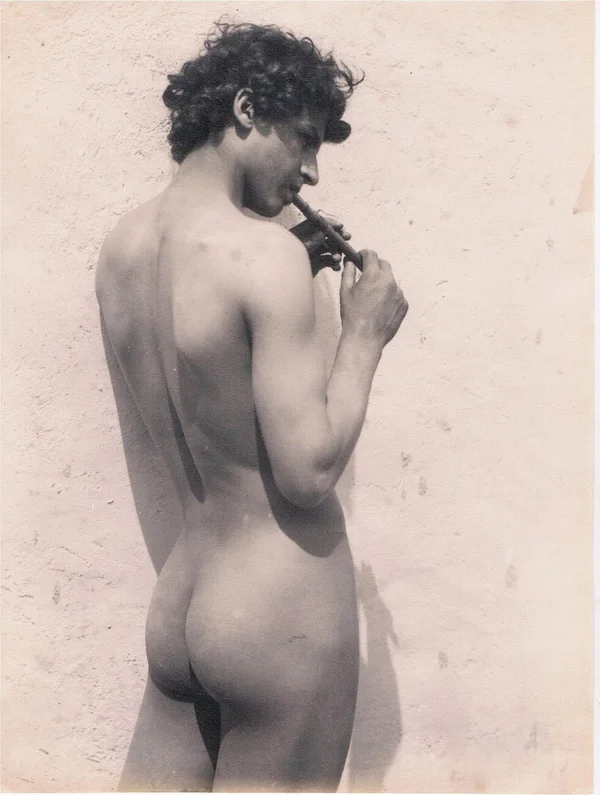 curly-boy-from-behind-playing-fife male