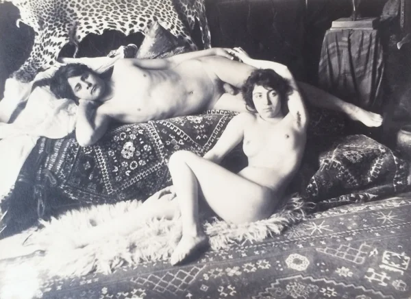 lad-and-woman-both-naked-reclining-on-rugs date-2014-04-15 mixed-genders