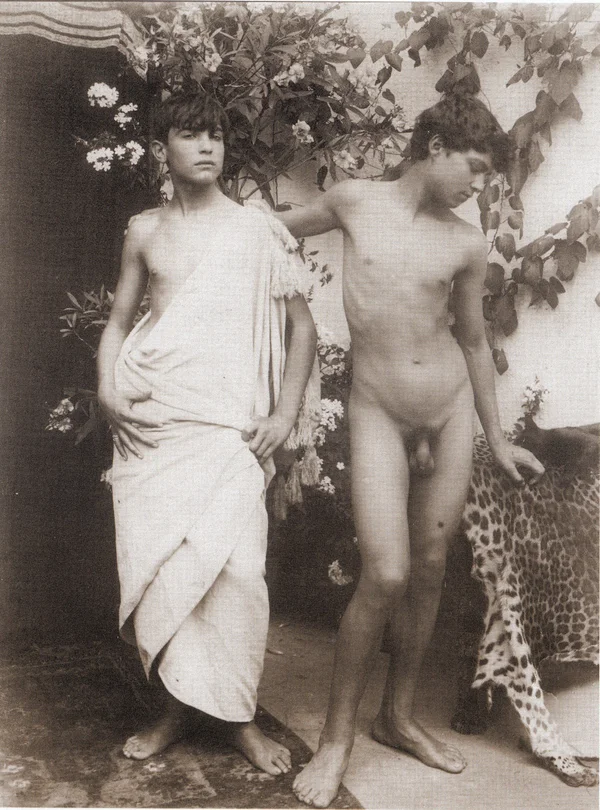 naked-boy-standing-by-boy-wearing-toga male