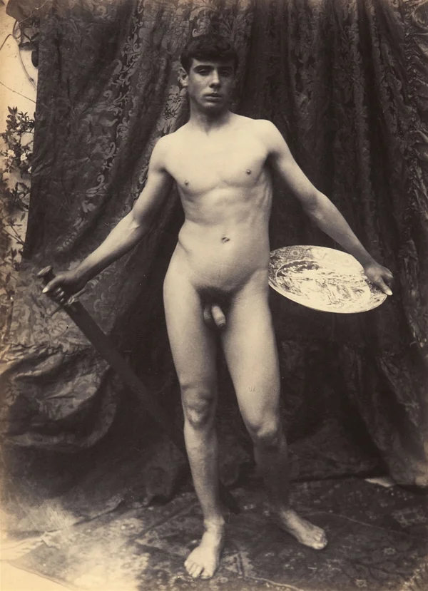 naked-lad-holding-sword-and-plate-in-front-of-brocade-cloth male