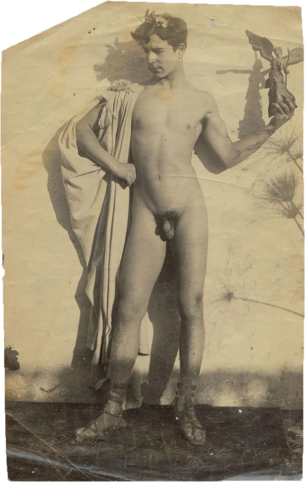 nude-boy-bearing-statuette-of-nike male