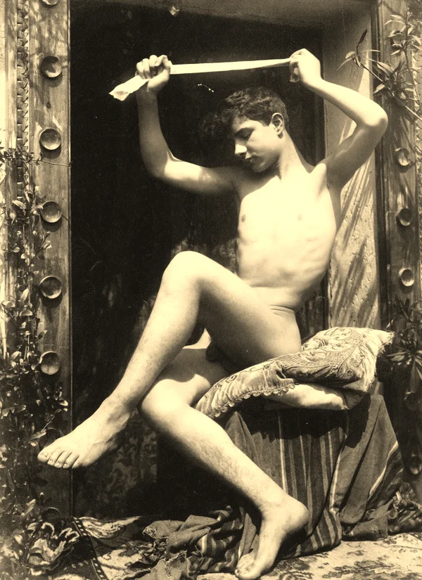 nude-boy-within-studded-door-frame male
