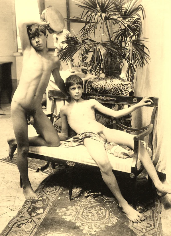 two-nude-boys-posing-on-empire-style-sofa male