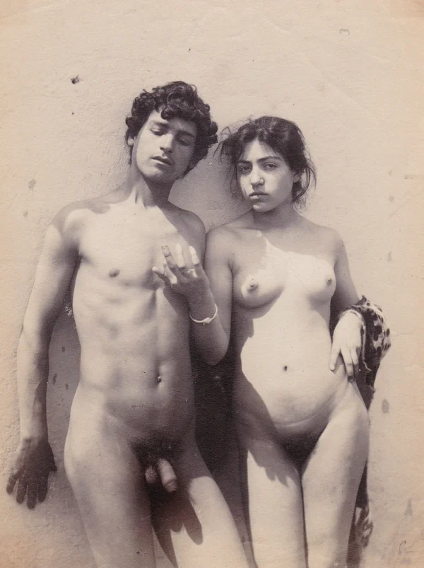 young-man-and-woman-naked-leaning-on-wall mixed-genders