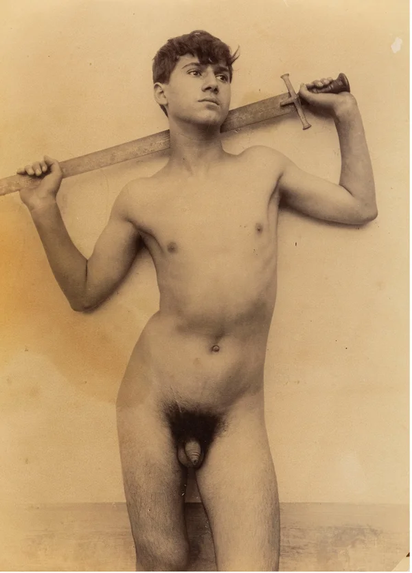 youth-naked-holding-sword-on-shoulders-in-front-of-brocade-cloth male
