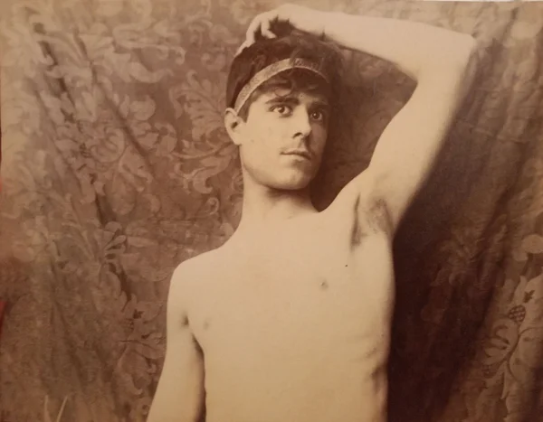 youth-with-raised-arm-wearing-headband male